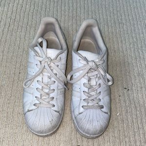 All white adidas sneakers